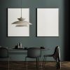 Dark grey dining room interior with two posters