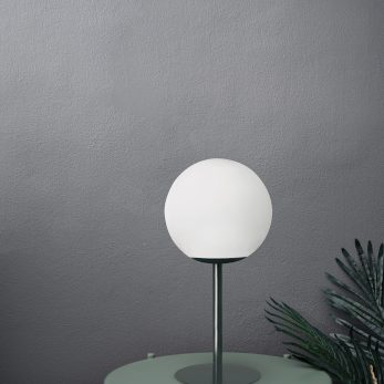 Empty scene with green metal side table in artificial plants and