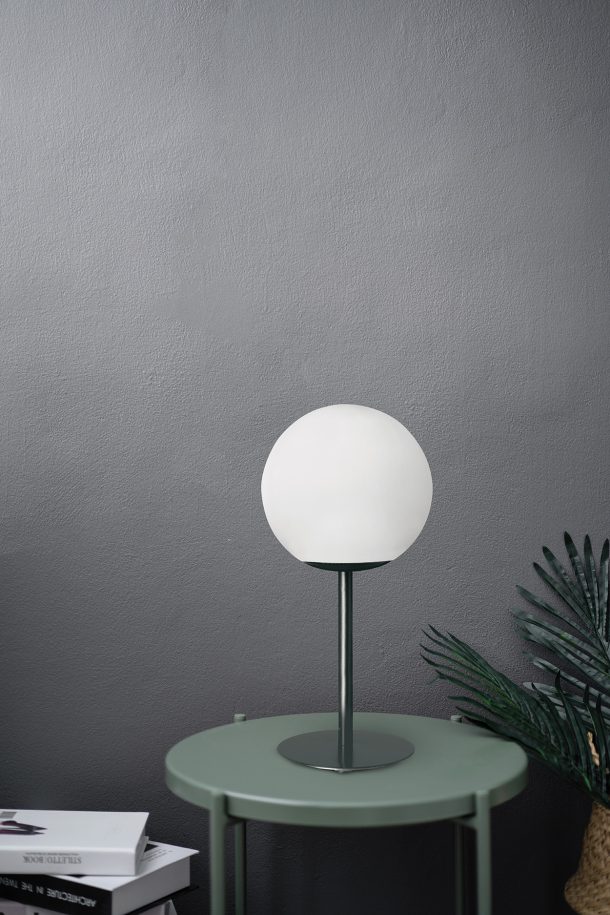 Empty scene with green metal side table in artificial plants and