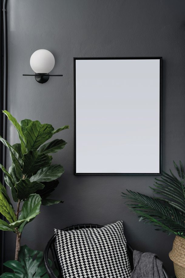 Compostion empty natural wooden frames setting on gray painted w
