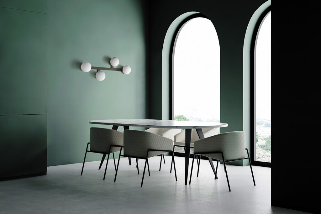 Green dining room corner with arched windows