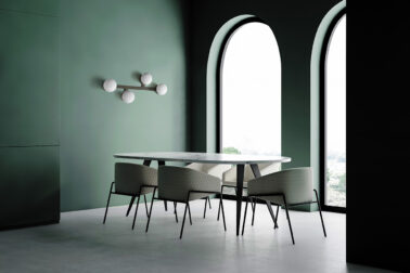 Green dining room corner with arched windows